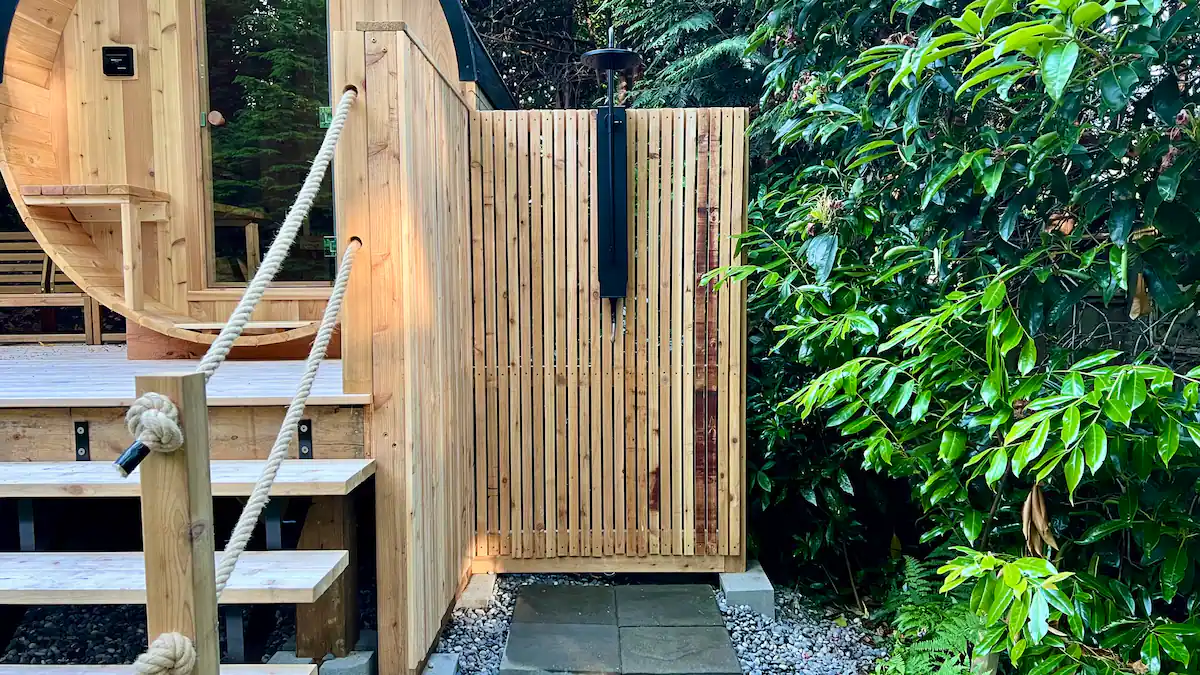 The cedar cold shower beside the sauna deck